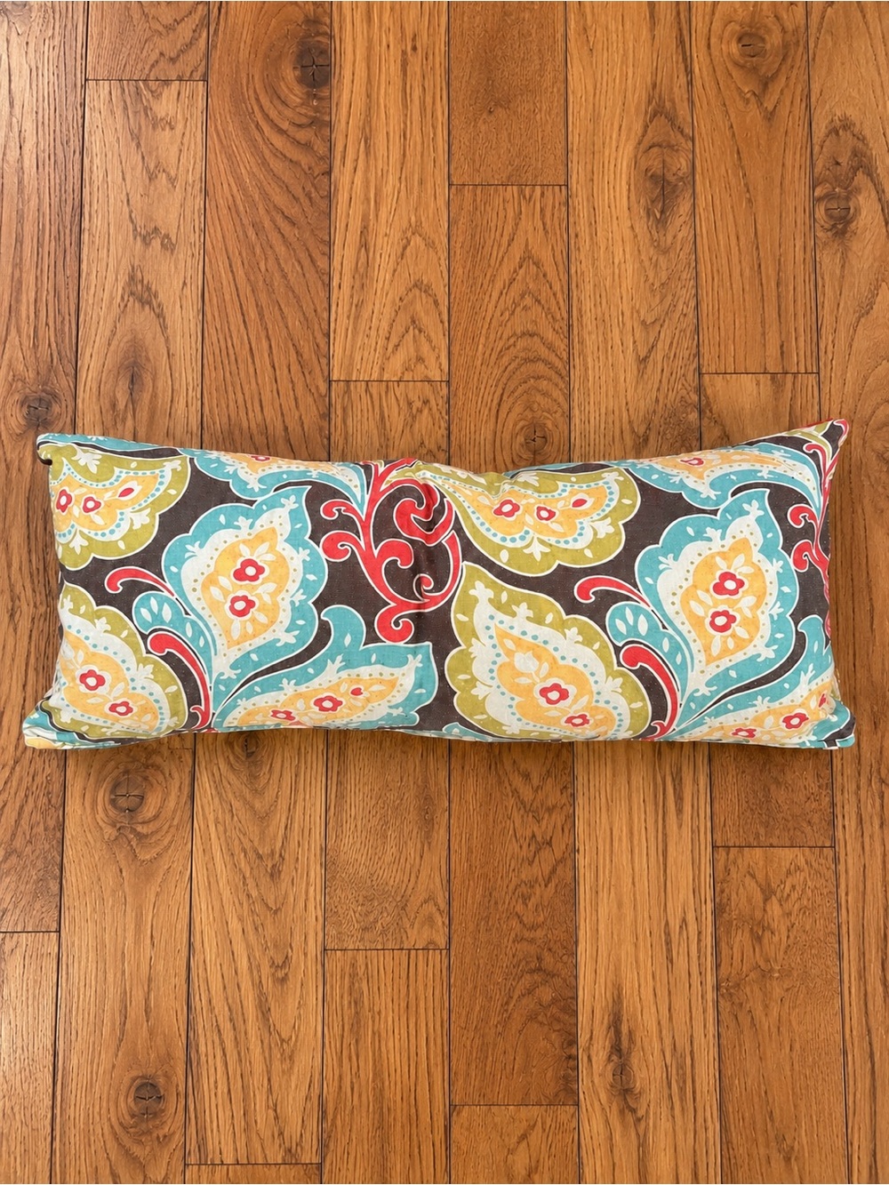 Newport Made in USA long lumbar decorative pillow with a bold multicolor paisley